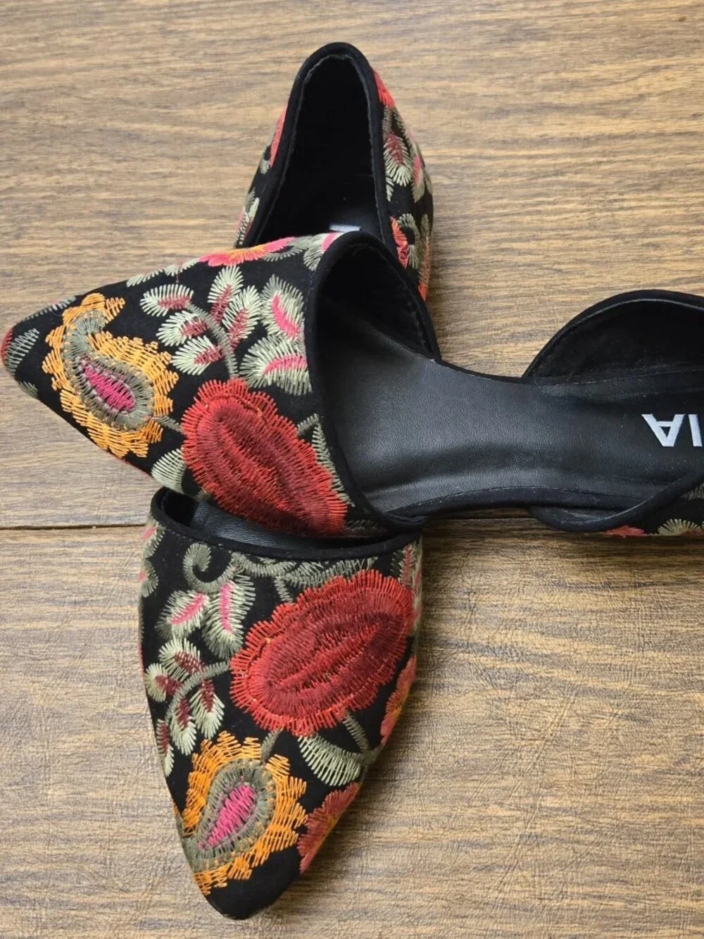 MIA Caroline Floral Embroidered d'Orsay Pointed Toe Flats on Black Background